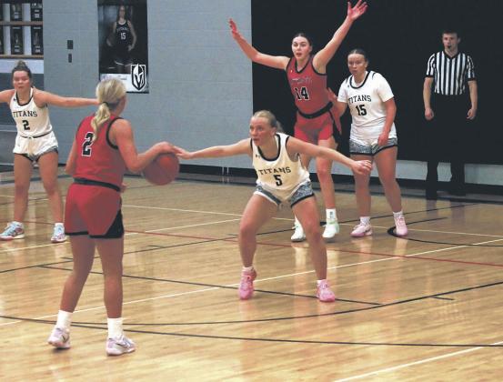 DVE senior Reese Fering defends against May-Port CG junior Kiaza Carlson. Photo by Jamie Rarick