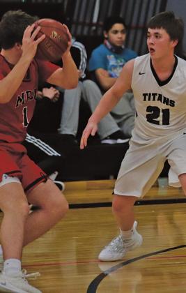 Alex Swanson guards Patriot Josh Evans last Thursday night in the Drayton gym. VNV Photo by Lesa Van Camp