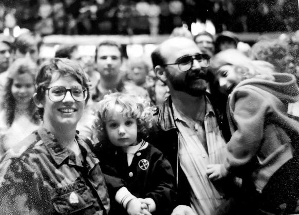 Kristi after reuniting with her husband and young daughters, Laney and Houston, upon her arrival from her deployment.