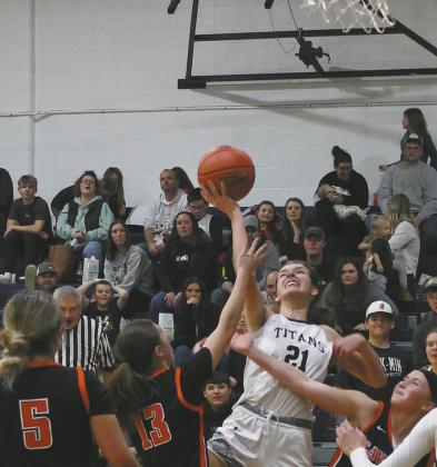 Facing heavy defense, senior Elizabeth Fedje puts up the shot. Photo by Jamie Rarick
