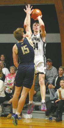 Facing of against North Border defender Garret Willits, DVE's Jack Langerud goes for the shot. Phot by Jamie Rarick