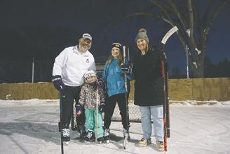 The Orr family takes a break to pose for a photo during a hockey outing at Lions Park in Bismarck on Jan. 12, 2023. From the left Tom, Brekken, Juliette Orr and Matty Orr. The family relocated to North Dakota in August as one of the first families to use the revamped Find the Good Life initiative. Photo Michael Standaert, North Dakota News Cooperative.
