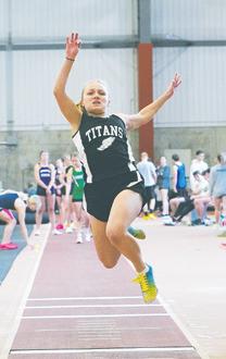 Reese Fering gives it her all in long jump.