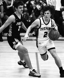 Logan Wieler drives the ball past the Eagle’s defense. Photo by Lyle Van Camp.