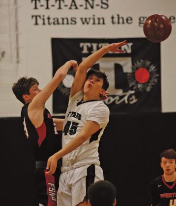 Gage Pollestad opens Saturday afternoons game against Finley Sharon Hope Page with the jump ball. VNV Photo by Lesa Van Camp