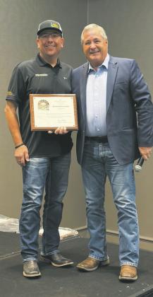 Scott Johnson, owner, (left) receives 2025 North Dakota Outstanding Pesticide Dealer of the Year at the North Dakota Ag Association meeting in Fargo, N.D. Pictured with North Dakota Ag Commissioner, Doug Goehring (right). Submitted photo.