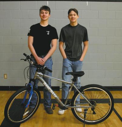 The Drayton PTO sponsored two free bikes to junior high and high school students as part of March’s reading month at DPS. Winners Landon Mapel and John Gunter are pictured with one of the bikes. Photo by Jamie Rarick