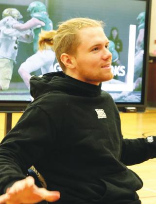 Hunter gestures as he makes a point while visiting with grades 5-8. VNV photo by Lyle Van Camp