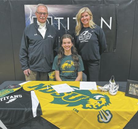 ‘FEDJE’ CON’T PAGE 10 Elizabeth Fedje with coaches Murph Thompson and Jodi Fedje. Submitted photo