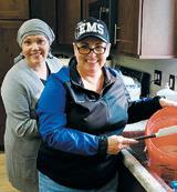 Kayla Thompson and Cindy Collette whip up some pancake batter on Sunday. Photo by Rob Boll.