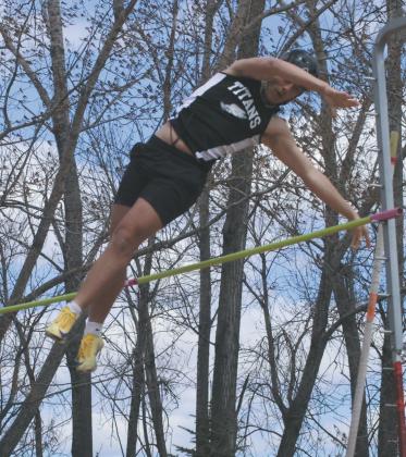 Clearing the bar, DVE junior Carter Johnson flies through the air during the Mens Pole Vault competition, ending with a first place finish at a height of 10' 6'. Photo by Jamie Rarick