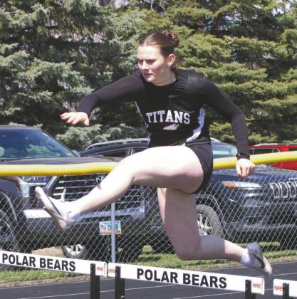 Finishing with a season best, DVE junior Ingrid Myrdal cleared the hurdles and placed 5th in the Girls 300 Hurdles. Photo by Jamie Rarick