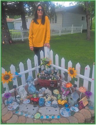 LeeAnn Johnson with one of her many fairy gardens. Photo by Christine Jensen