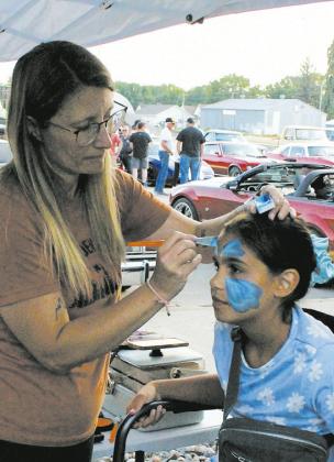 Ciera Dalzell got her face painted by Leanna Lindegard during Thursday's Riverfest events. Photo by Jamie Rarick