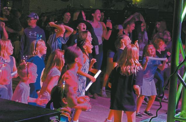Kissing Company (and the audience) belts out Pink Pony Club, one of the more popular songs of the evening. Photo by Rob Boll