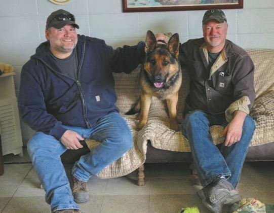 Jeremy Praska (left) and Greg Andreen (right) pose with Freeway at The Animal Elskan Inn last Friday.