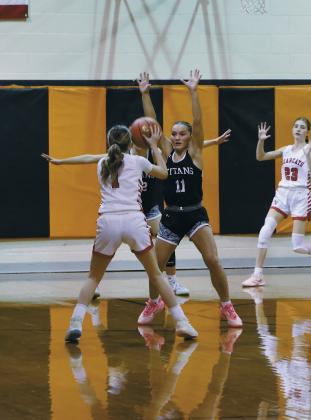 DVE senior Jacey Nelson attempts to block North Star's Ashley Nikolaisen. Photo by Jamie Rarick