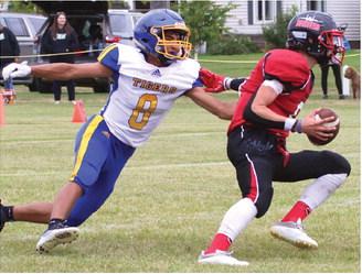 Gavin Ryan breaks free from a would be Trenton tackler.