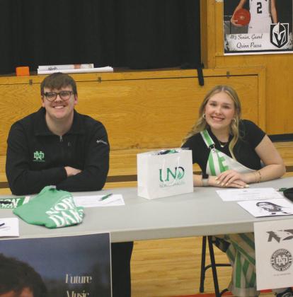 Ian Peterson (left) and Rylee Maurstad (right) at the table that represented student’s heading to UND this fall. Photo by Andrea Johnston