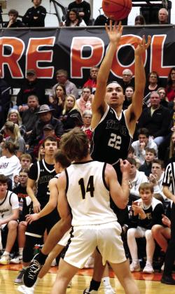 DVE junior Mason Pollestad goes for the basket over Park River defender Luke Shirek. Photo by Jamie Rarick
