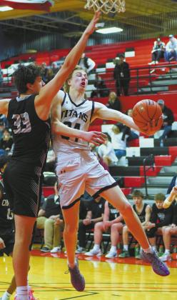 Nelson County defense blocks the shot attempted by DVE Senior Jack Langerud. Photo by Larry Stokke