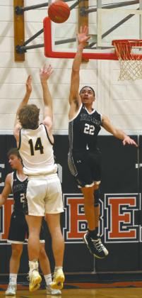 Park River's Luke Shirek attempts the shot, but is blocked by DVE's Mason Pollestad. Photo by Jamie Rarick Students cheer on the Titans at the Region 2B Tournament in Devils Lake Monday night. Photo by Larry Stokke