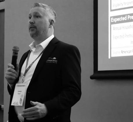 Lance Boyer, sales director of financial products for the North Dakota Farmers Union, talks about expiring Affordable Care Act premium tax credits during the annual meeting of the North Dakota Farmers Union on Dec. 12, 2025. (Photo by Michael Achterling/North Dakota Monitor)
