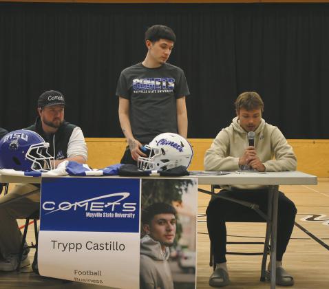 Trenton Bronson-Keena reads Trypp Castillo’s bio during Senior Signing Day. Photo by Rebecca Davis