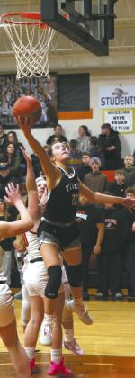 Titan senior Jaelyn Johnson extends for the basket during play against Cavalier Jan 5. Photo by Jamie Rarick