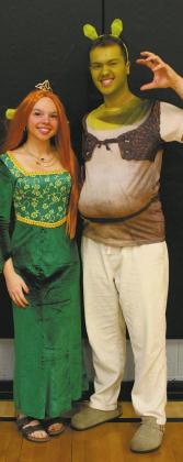 Going all out, juniors Hope Patterson and Maddox Oihus dressed as Fiona and Shrek for 'Movie Day' during homecoming week. Photo by Jamie Rarick