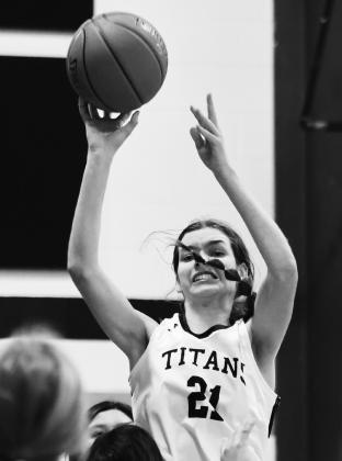 Elizabeth Fedje shoots over a crowd against Warwick. Photo by Lyle Van Camp.