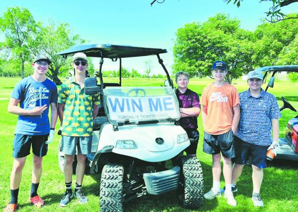 JJ Knudson, Gavin Ryan, Connor Corrick, Drew Passa and Jaxon Woinarowicz pose with the golf cart being raffled off. For a chance to win, contact Barbie Steenerson.