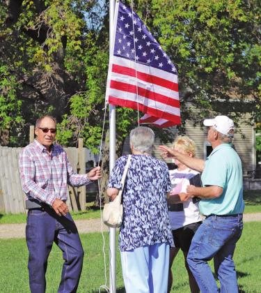 Dave Kirkeby’s siblings raise the flag that was placed at the Blessing Museaum site in his honor last fall. VNV photo by Lesa Van Camp