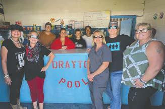 Amy Scharmer Memorial Ride group pictured with Drayton Swimming Pool lifeguards after $2,000 donation was made. Front Row: Christine Jensen, Tarri Keena, Jamie Twamley, Jess Aasand, and Cindy Watts. Back Row: Ian Peterson, lifeguard; Daniellia Pokrzywinksi, pool manager; Drew Passa, lifeguard; Trenten Bronson-Keena, lifeguard.