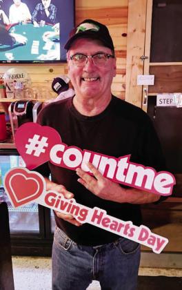 Brian Woinarowicz poses for a photo at Johnny Bravos.