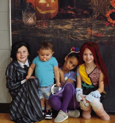 Suttyn Halvorson, Ivy Talamantes, Mia Johnson, and Sophie Woinarowicz pose for a photo at the Booster Club event.