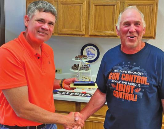 Mayor Chip Olson presents Randy Schuster with parting gifts for his 24 years of service to the City of Drayton. Photo submitted by Michael Larson