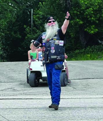 Randy “Boomer” Hills doing what he does best - assisting with one of Drayton’s recent motorcycle rides. Photo by Sandy Kovar at ShaBu22 Photography.