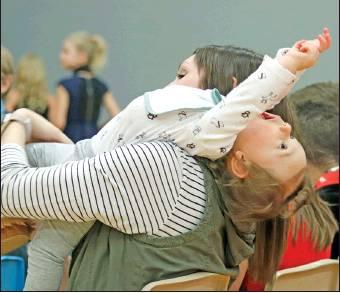 Mrs. Allison Littlejohn who is the 4th grade teacher did double duty at the concert trying to keep her daughter Lacey entertained while sitting with her class during the concert. VNV Photo by Lesa Van Camp