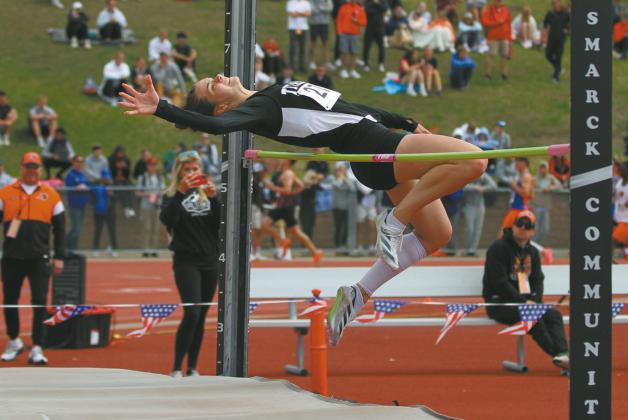 Junior Elizabeth Fedje clears the bar during the Class B Girls' High Jump Friday at the State Track Meet. Fedje won the state championship in the event, clearing 5-feet-6-inches. Photo by Mike Alan Steinfeldt
