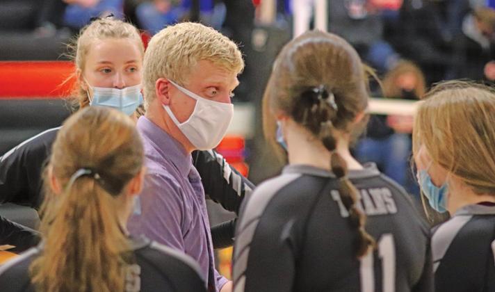 Coach Marcus Tucker talks to his team during the Play in match. VNV Photo by Lesa Van Camp