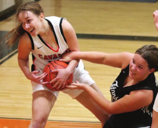 Hailey Berg fights for control of the ball in action at Cavalier. VNV photo by Lyle Van Camp