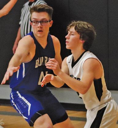 Logan Wieler is guarded by Burro Caden Waterworth last Friday night. VNV photo by Lesa Van Camp