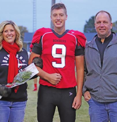 Pictured left: Genafay, Damian, and Dennis Pokrzywinski were honored prior to the Homecoming game Friday night. VNV Photo by Lesa Van Camp
