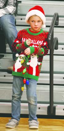Elliott Thompson wore his ugly sweater and Santa Hat to the game last Friday evening. Photo by Lyle Van Camp.