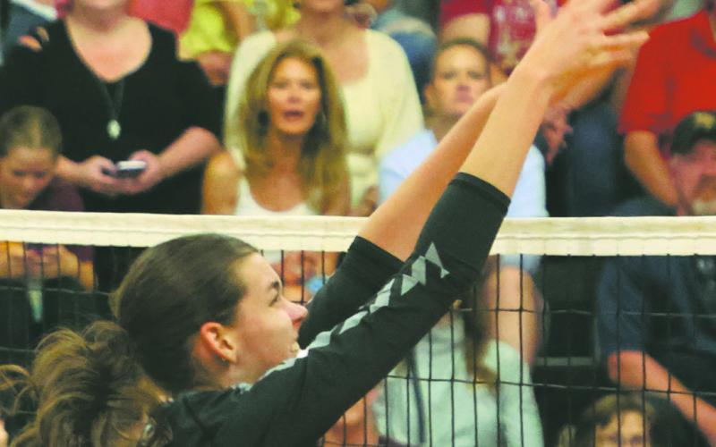 Elizabeth Fedje puts a kill attempt over the net in action in Drayton last week. Photo by Lyle Van Camp