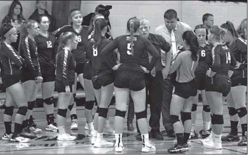 Coaches Tucker and Laxdal have a time out to talk strategy with the team. VNV Photo by Lesa Van Camp