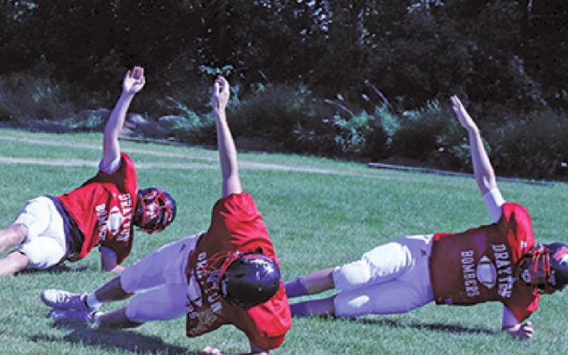 Members of the Bombers varsity team warm up at practice earlier this week. VNV Photo by Lesa Van Camp