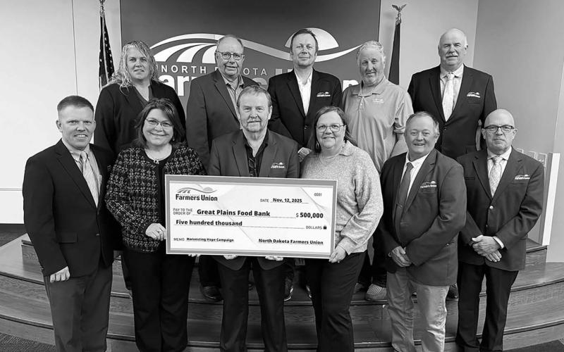 Pictured with NDFU President Mark Watne and the NDFU State Board of Directors are Marcia Paulson (at left), GPFB philanthropy officer, and Michelle Watne, Harvesting Hope Campaign honorary co-chair.