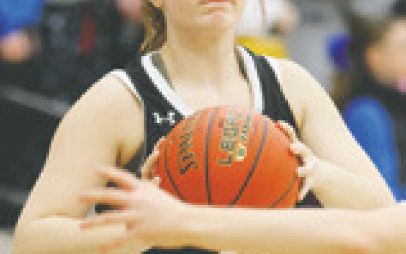 Kiara Aasand looks for an open player. Photo by Lyle Van Camp.